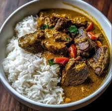 Coconut Rice and Goat Meat Sauce